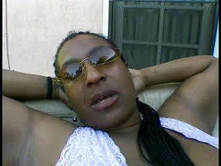 Hung black stud relaxes on the couch while getting sucked off by a MILF